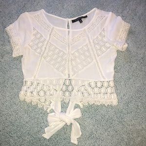 Cropped , see through top .